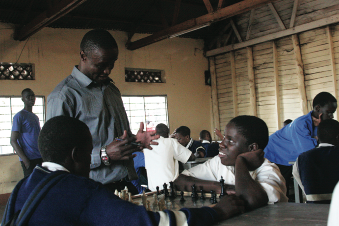 Robert Katende and Phiona Mutesi at Robert’s chess program.